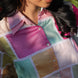 Close-up of an aesthetic colorful patchwork shirt with a blurred background
