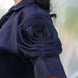 Navy blue shirt with a floral sleeve detail on a blurred background