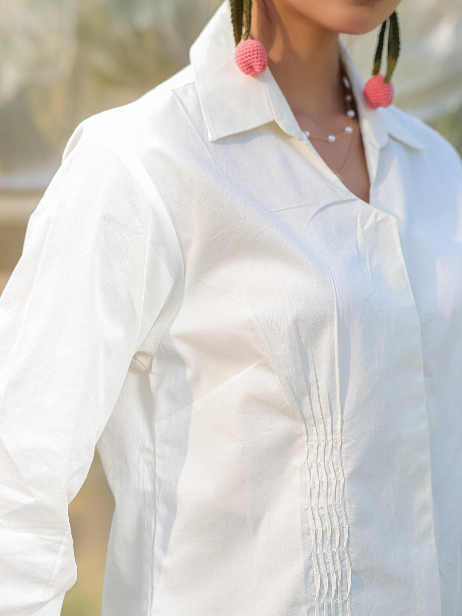 classy pintucks in front in a white shirt