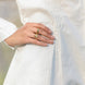 closeup of white shirt with pin tucks detailing worn by a woman 