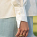 stylish asymmetrical buttoned cuff of a smart white shirt