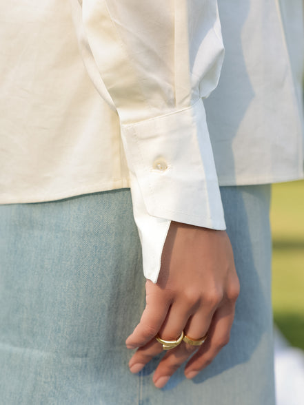 stylish asymmetrical buttoned cuff of a smart white shirt