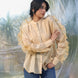 woman wearing a luxurious silk chanderi beige ruffled shirt