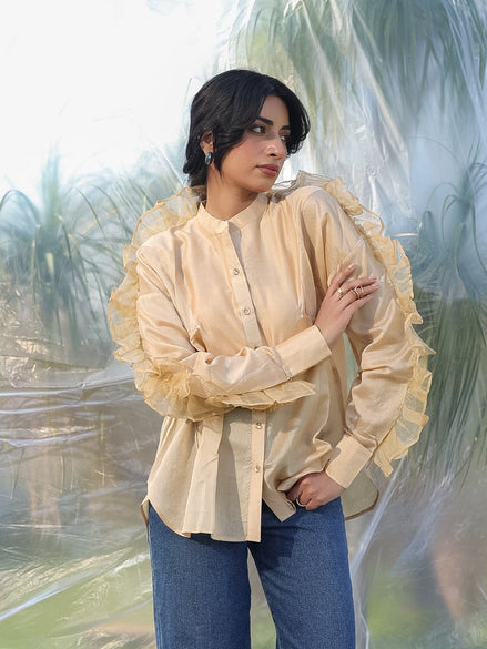 woman wearing a luxurious silk chanderi beige ruffled shirt