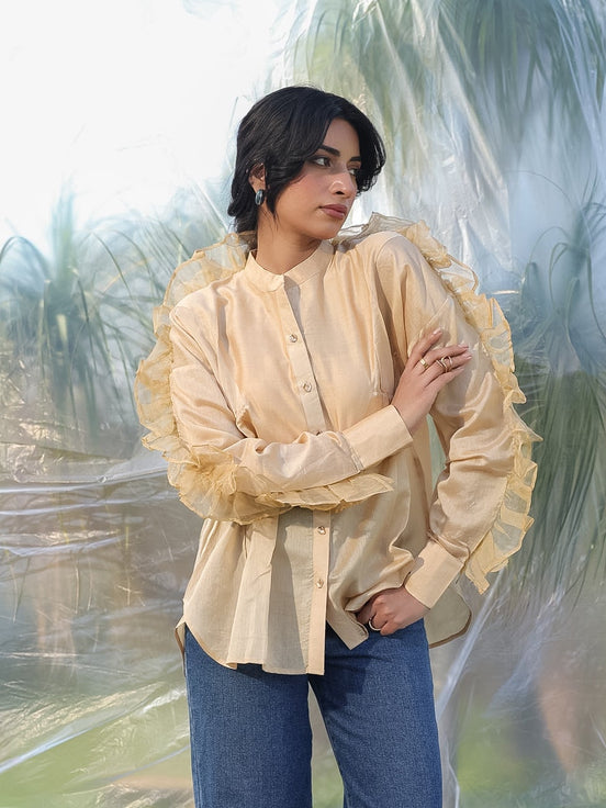 woman wearing a luxurious silk chanderi beige ruffled shirt