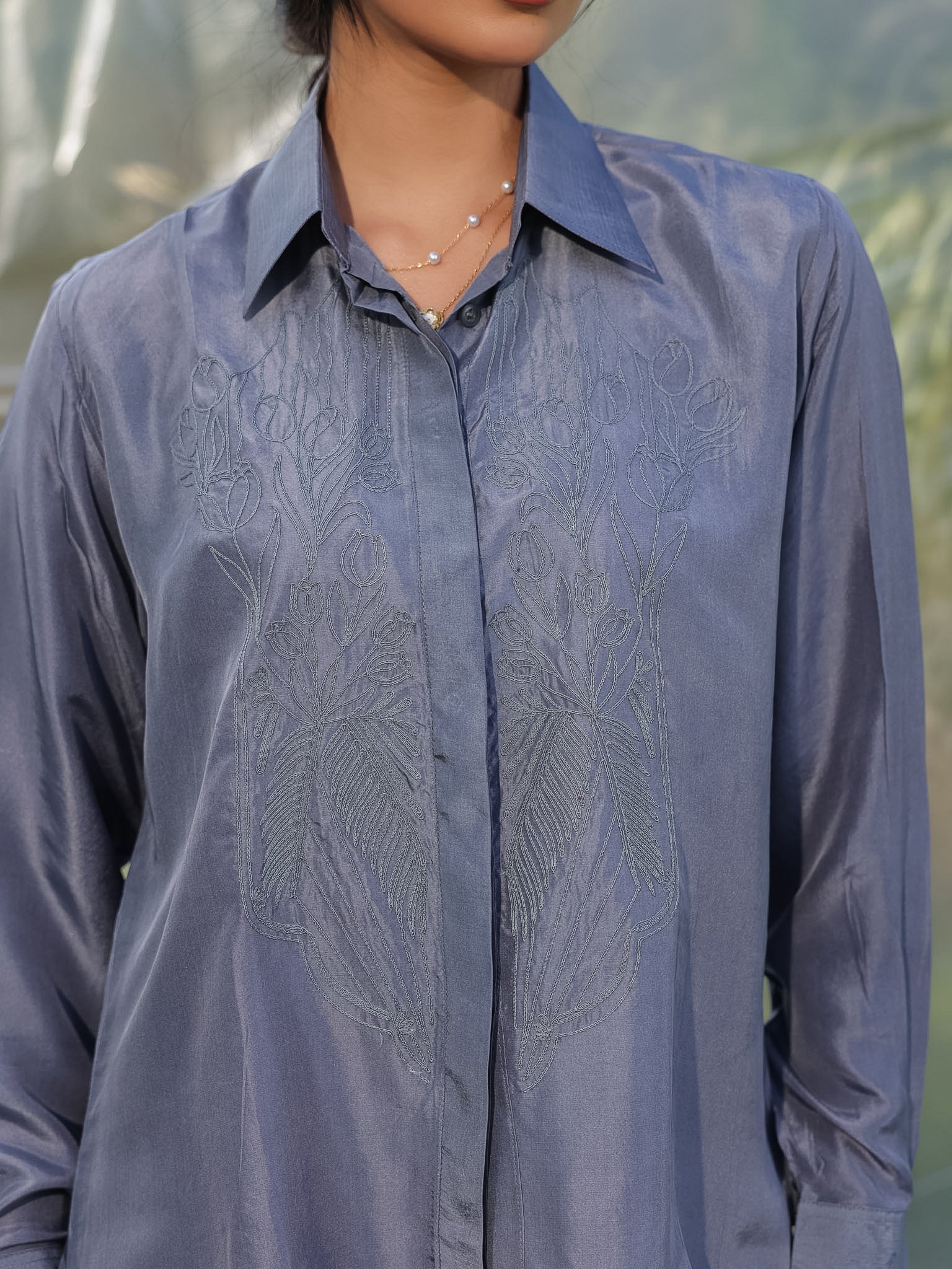 Grey Silk Dori embroidered shirt worn by a person with a blurred natural background