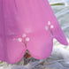 aesthetic shot of pink cotton linen skirt which has beautiful cut to its hem and tulip embroidery is delicately appliqued on the points