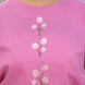 closeup of pink top with tulip embroidery which is appliqued