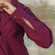 a stylish cuff of a wine shirt with golden buttons