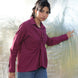 an aesthetic shot of a woman weaeing a stylish and designer marron wine red shirt