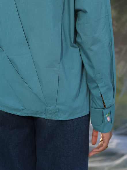 teal blue shirt with back central pleating