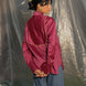 person wearing a maroon ilk chanderi shirt with contrast piping yoke in the b ack